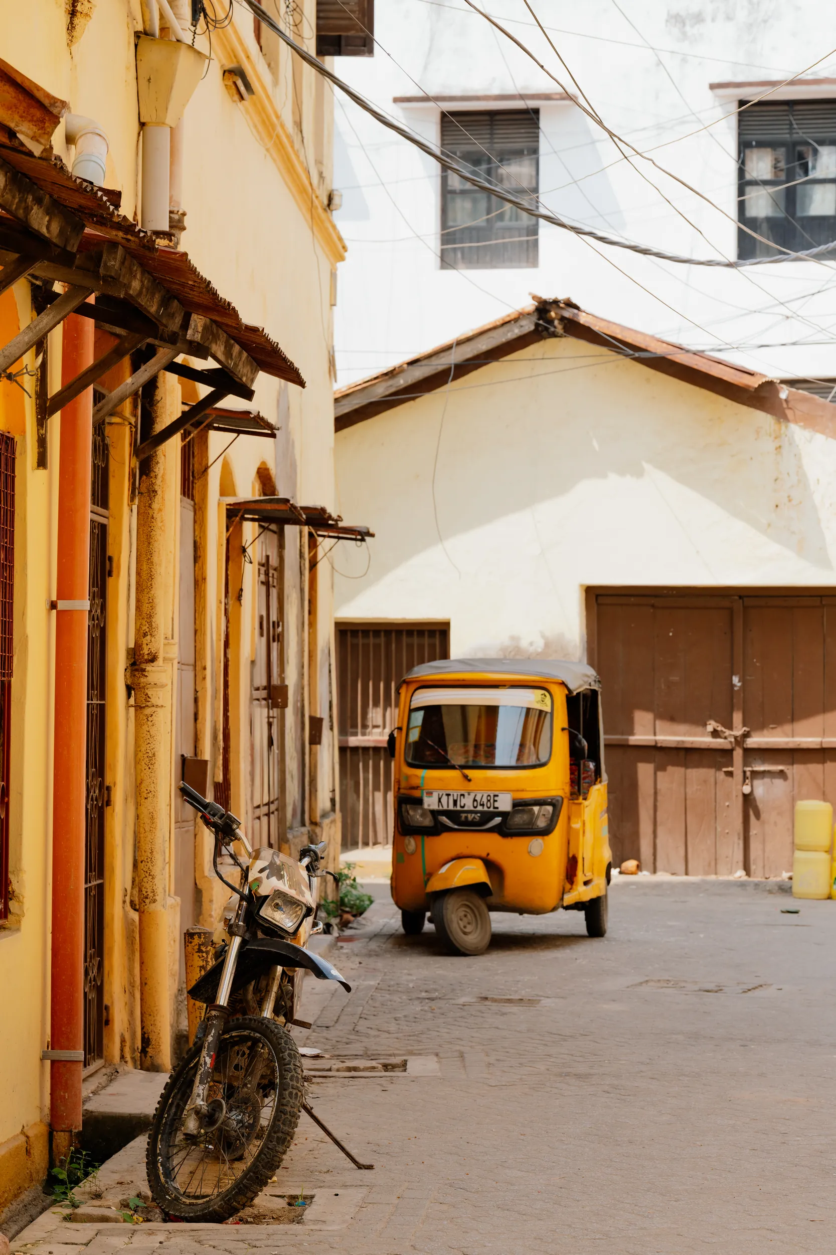 Narrow cobblestone alleyway in Mombasa Old Town