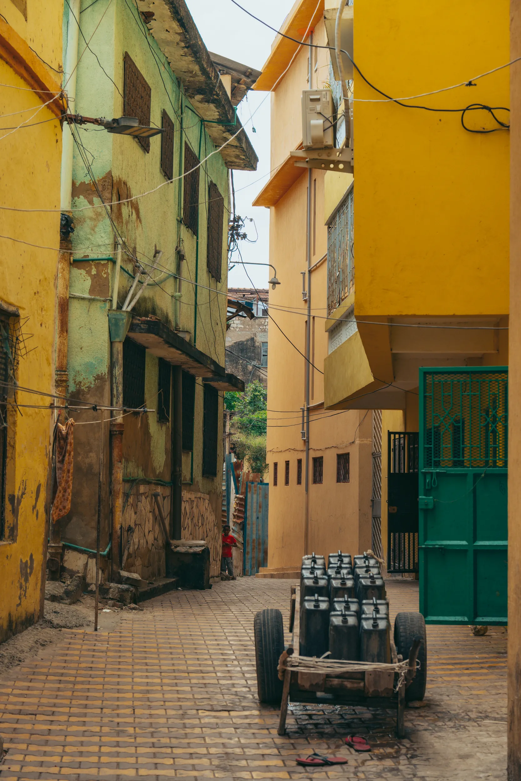 Pastel textures on crumbling concrete architecture in Mombasa