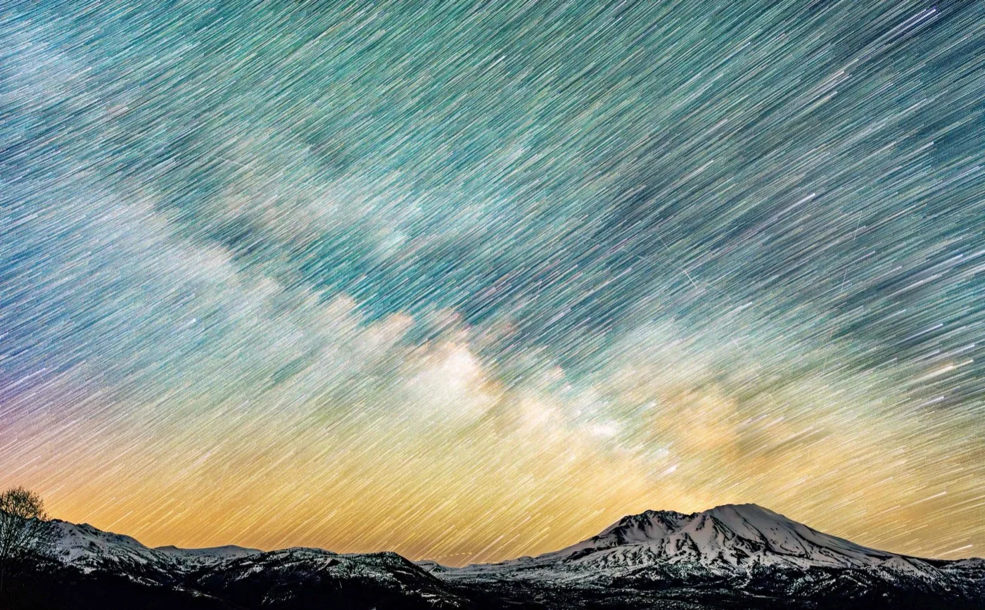 Milky Way star trails over Pacific Northwest volcano, astrophotography by By Farhan