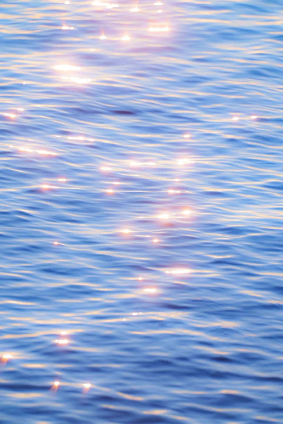 Sunlight glistening on calm Pacific ocean surface, fine art seascape photography by By Farhan